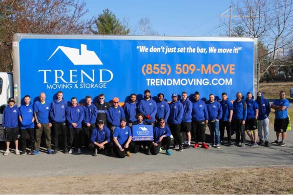 Trend Moving & Storage staff in front of a truck with their logo