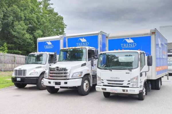 Three Trend Moving & Storage trucks